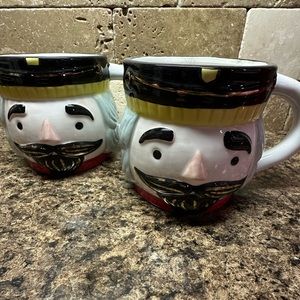 Set of two nutcracker coffee cups.